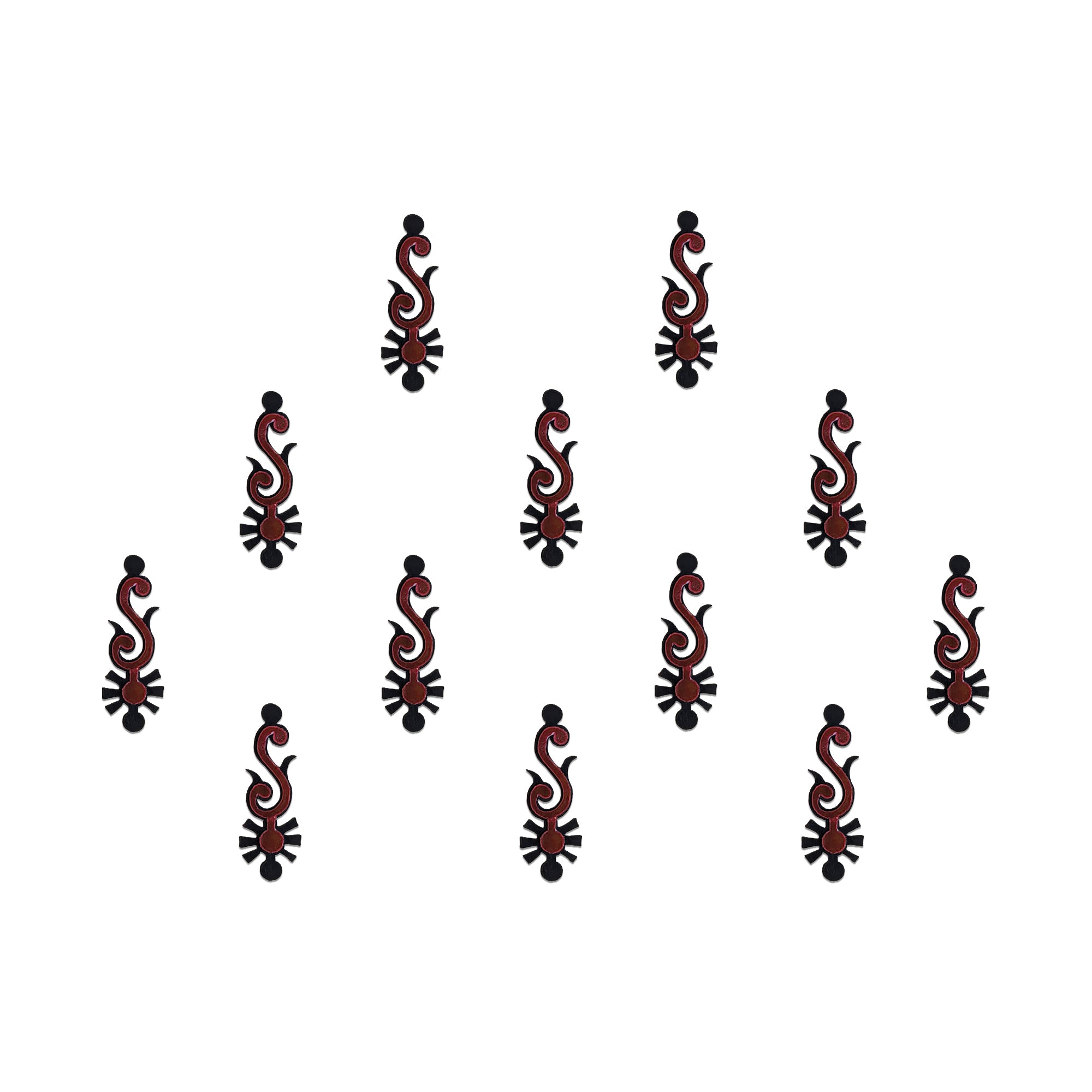 Comet Busters tribal spear designer bindis featuring elongated black and maroon ethnic motifs with geometric detailing arranged symmetrically on a light background for a bold contemporary traditional style.