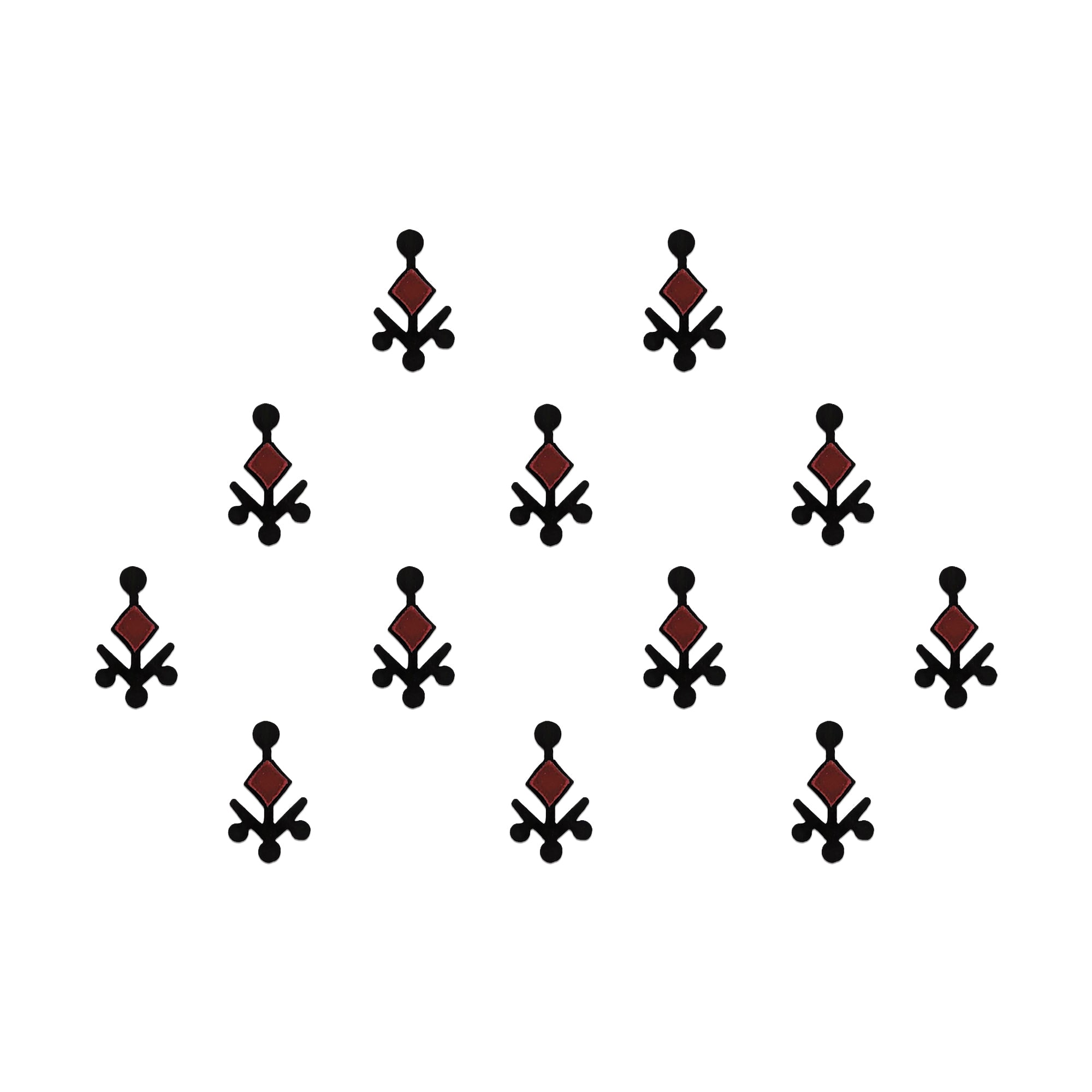 Comet Busters geometric tribal designer bindis featuring black abstract ethnic motifs with maroon diamond accents arranged in a symmetrical pattern on a light background for a bold contemporary traditional look.