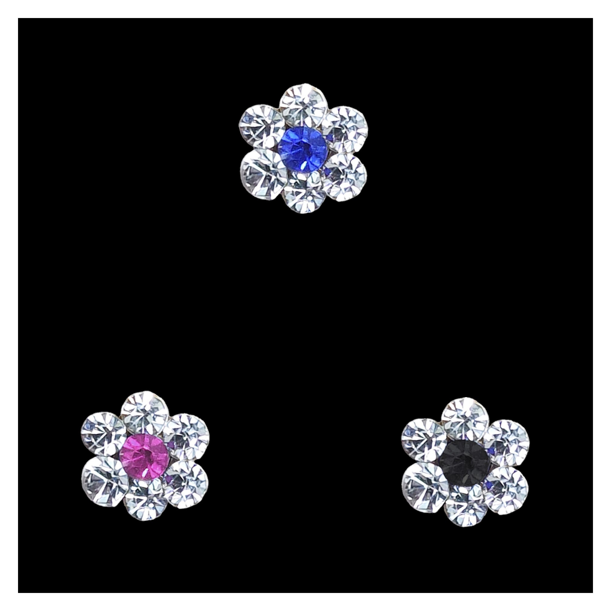 Comet Busters flower-shaped crystal nose stud featuring blue, pink and black center stones surrounded by sparkling clear crystal petals for women and girls