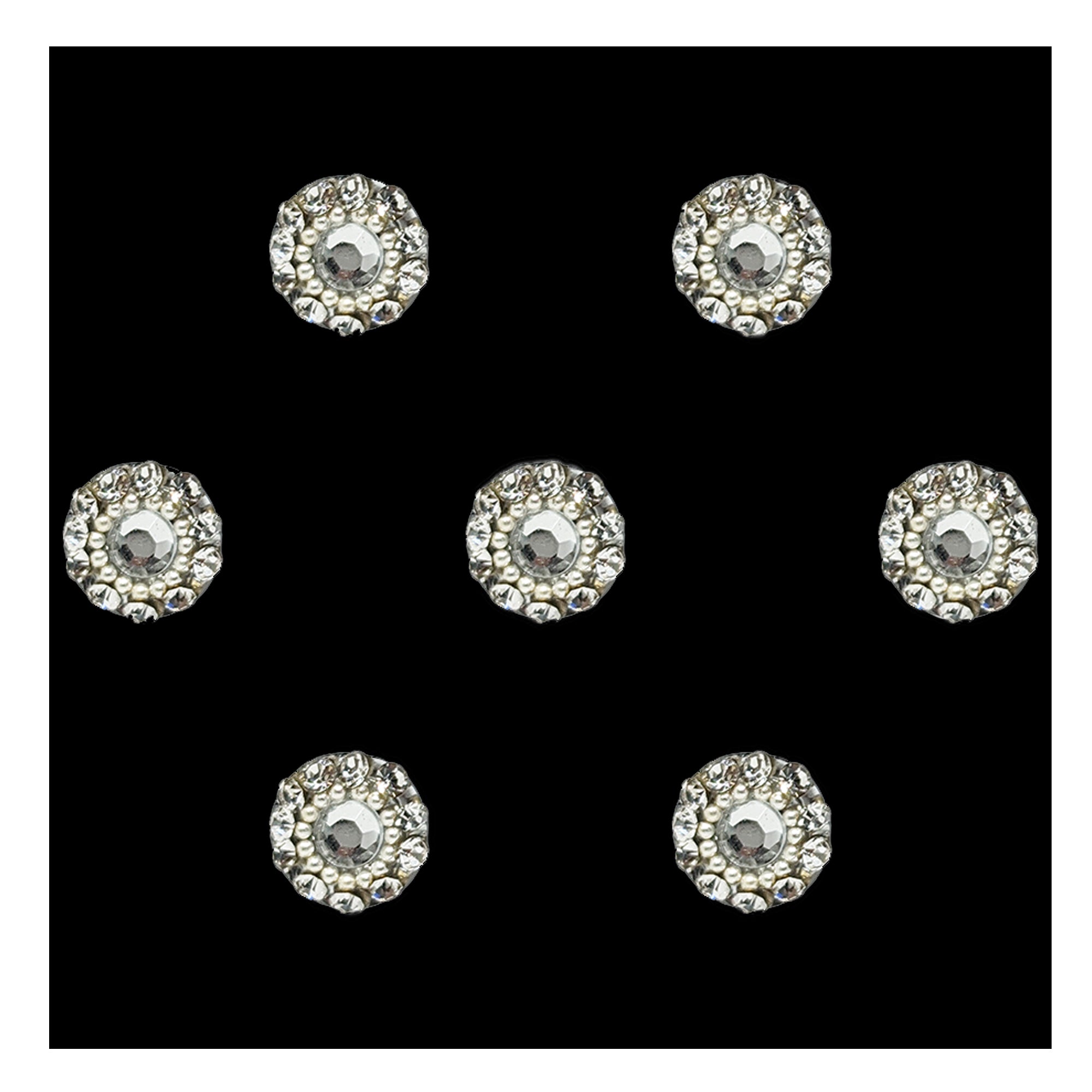 Comet Busters premium silver floral round bindis featuring a central crystal stone surrounded by sparkling rhinestones and delicate pearl detailing in an elegant designer pattern.