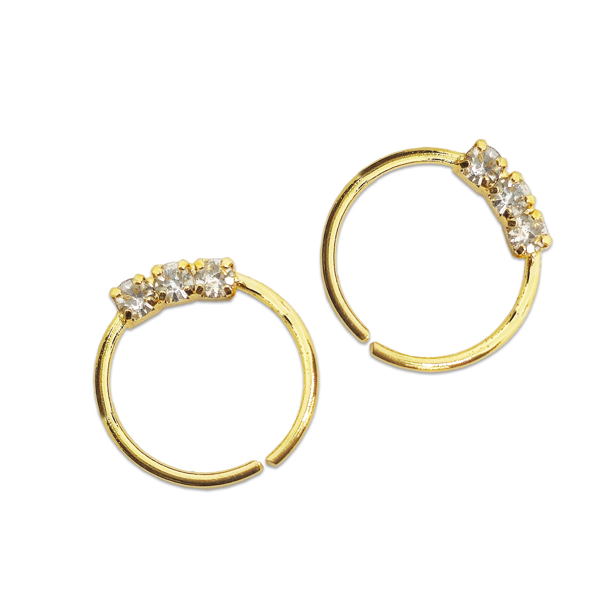 Comet Busters gold hoop nose studs with three sparkling clear crystal stones arranged in a row on a white background