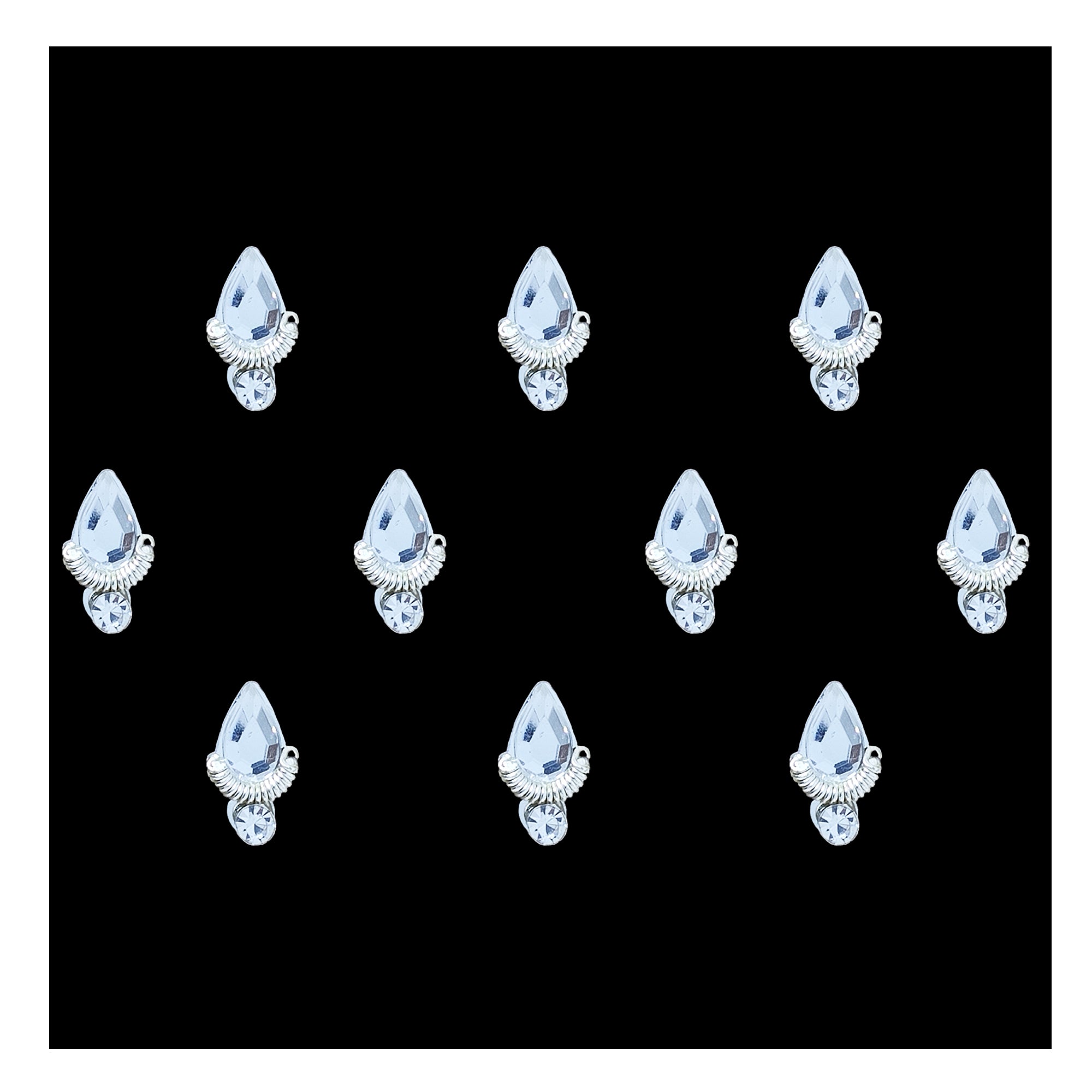 Comet Busters ice blue teardrop-shaped crystal bindi featuring a faceted light blue gemstone, an elegant silver fan-shaped base, and a sparkling round rhinestone accent. Premium self-adhesive designer bindi for women and girls, perfect for weddings, festivals, Navratri, Diwali, classical dance, parties, and traditional ethnic wear.