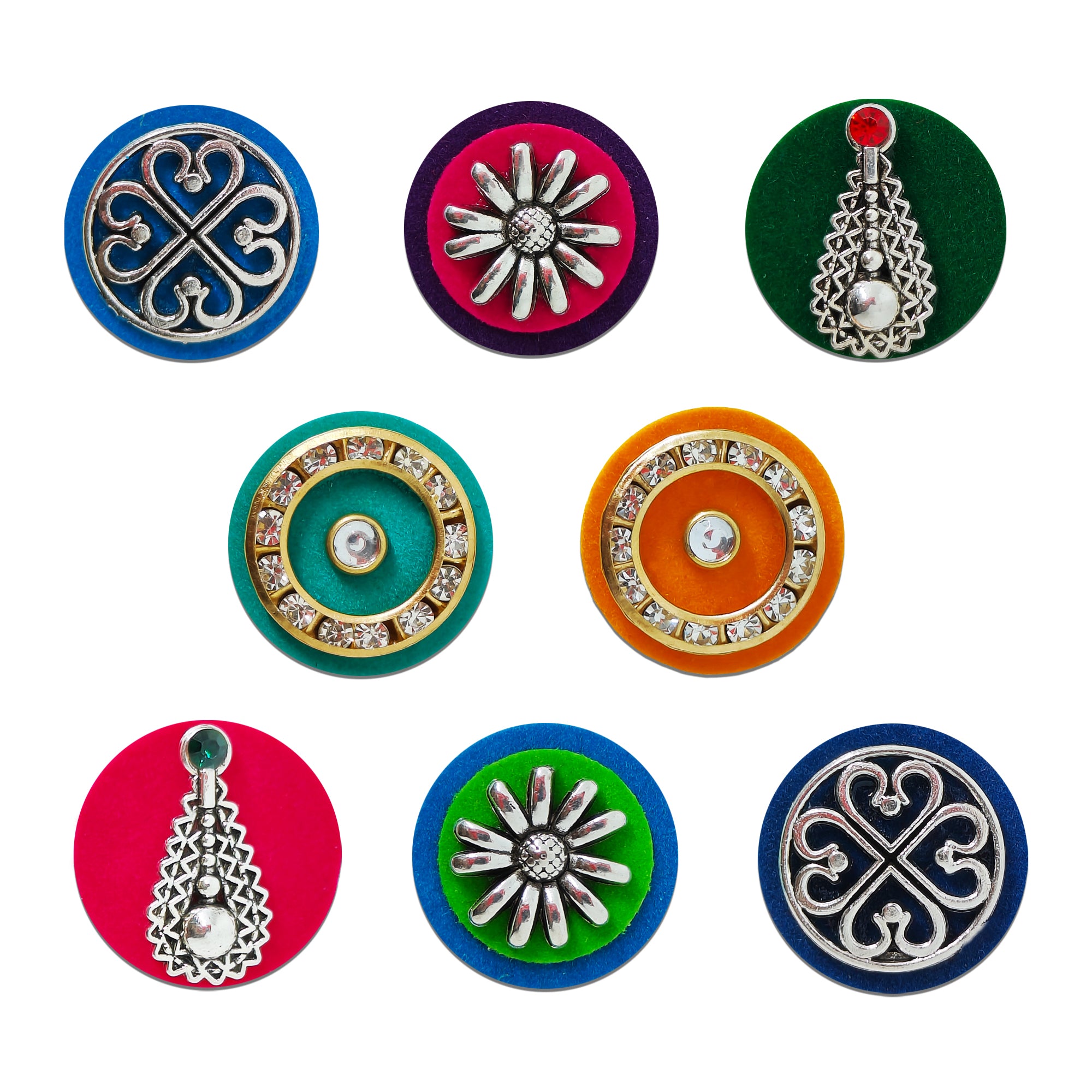 Indira by Comet Busters® premium designer bindi collection featuring heritage clover motifs, crystal halo circles, floral statement designs, and silver pendant embellishments on colorful velvet bases.