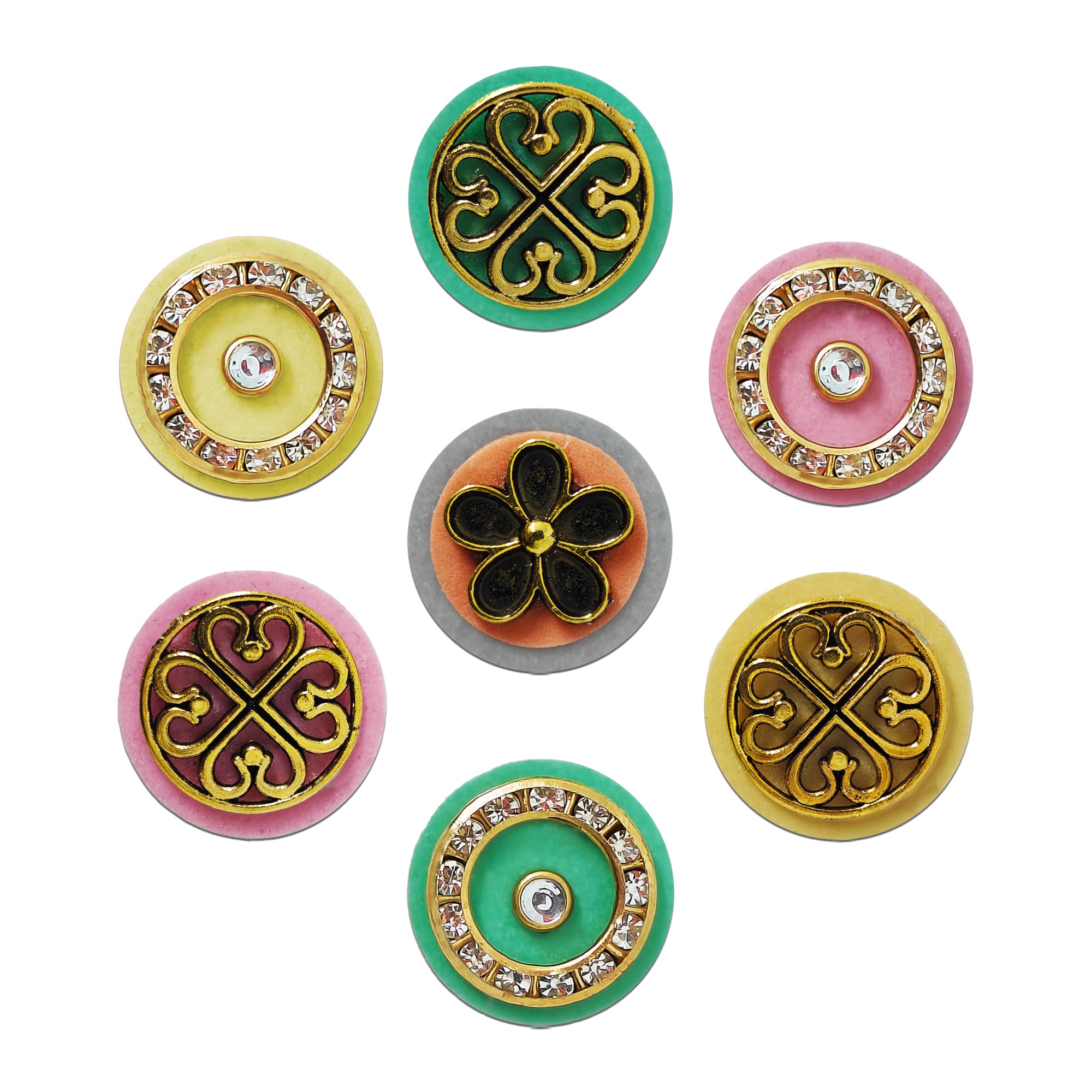 Indira by Comet Busters® premium pastel designer bindi collection featuring crystal halo rings, floral motifs, vintage scroll medallions, and metallic gold embellishments on pastel-colored velvet bases.