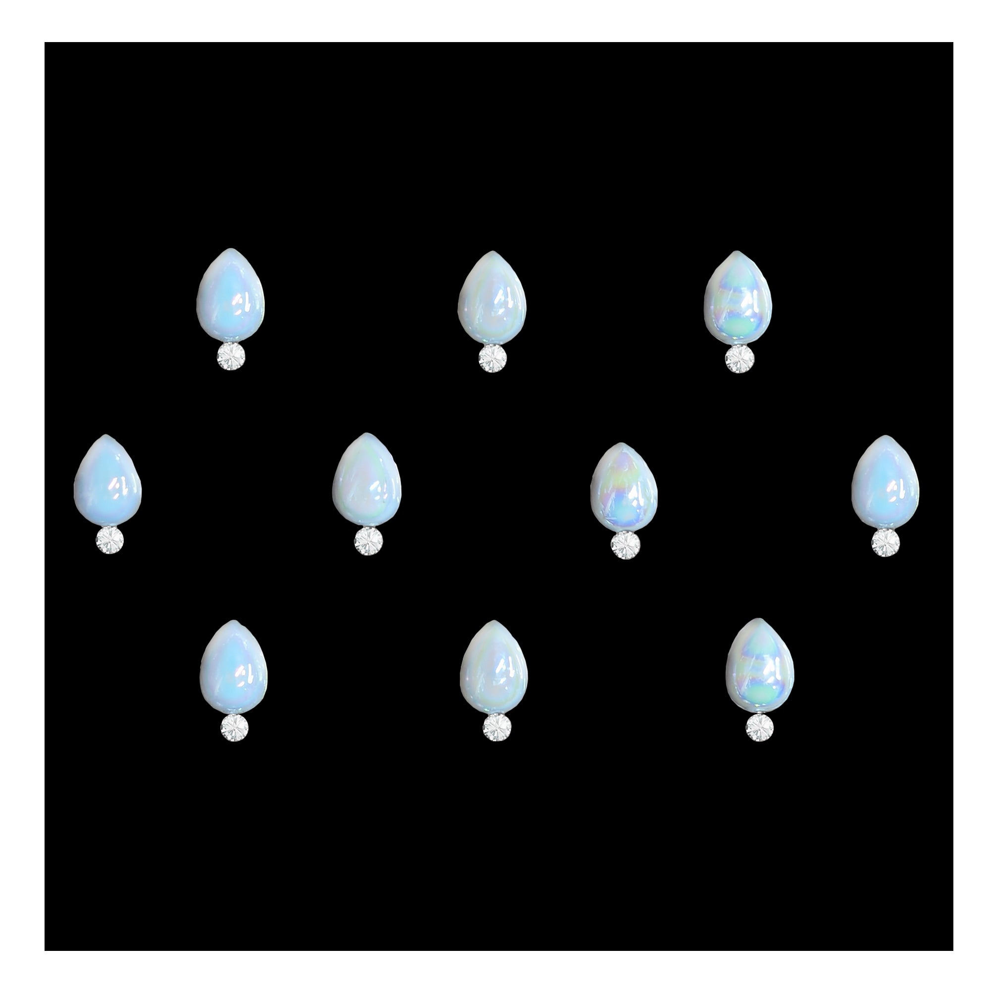 Comet Busters pearl round stone bindis featuring glossy iridescent white circular stones paired with small crystal accents on a black background, elegant self-adhesive festive bindi set for women and girls.