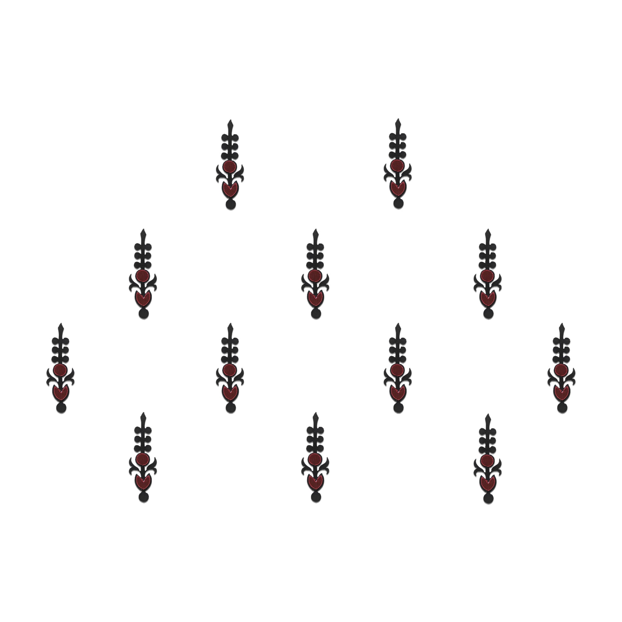 Comet Busters tribal designer bindis featuring black ethnic symbol motifs with a circular red stone center arranged on a light background, offering a bold fusion-inspired traditional look.