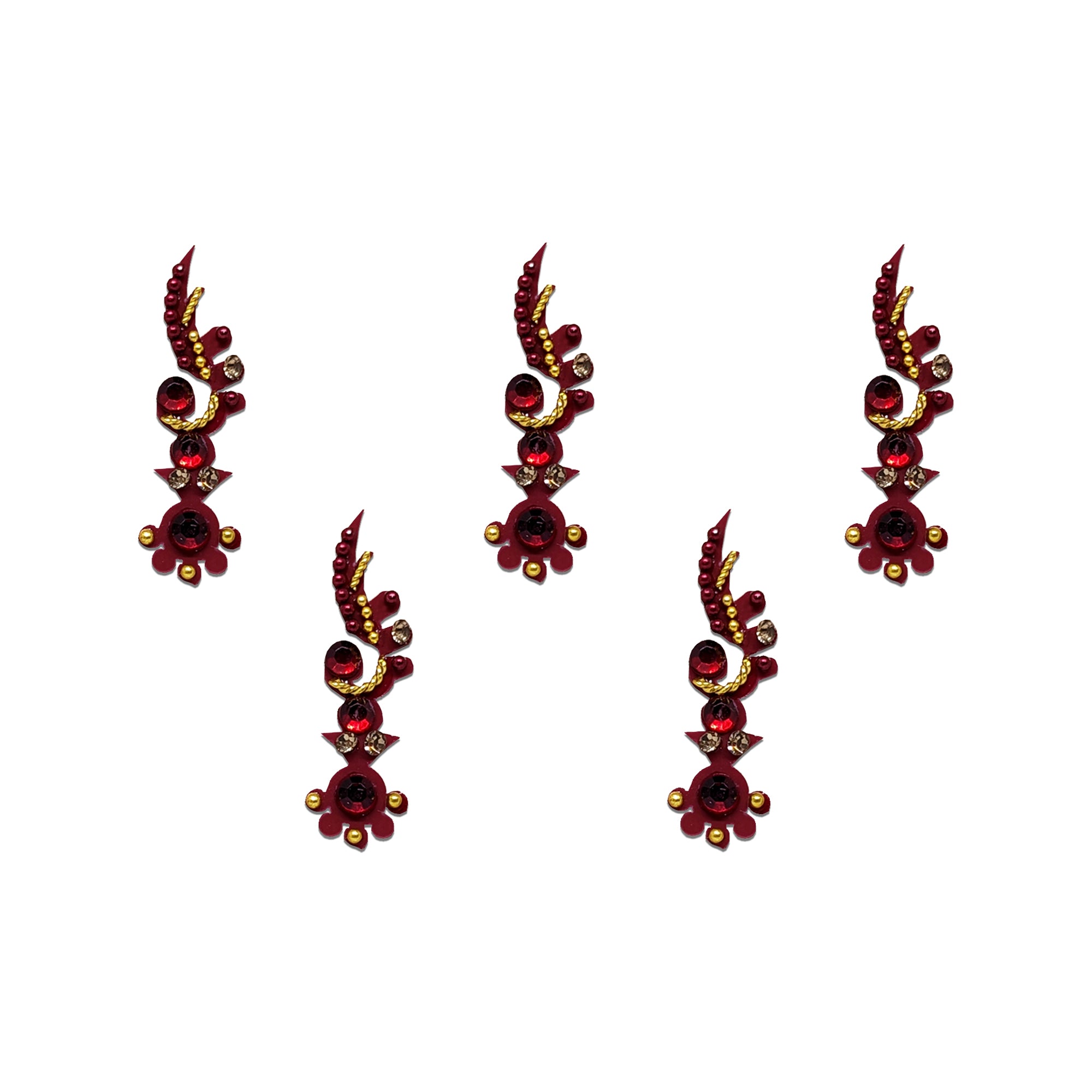 Comet Busters ruby red paisley stone bindis with floral accents and crystal embellishments.