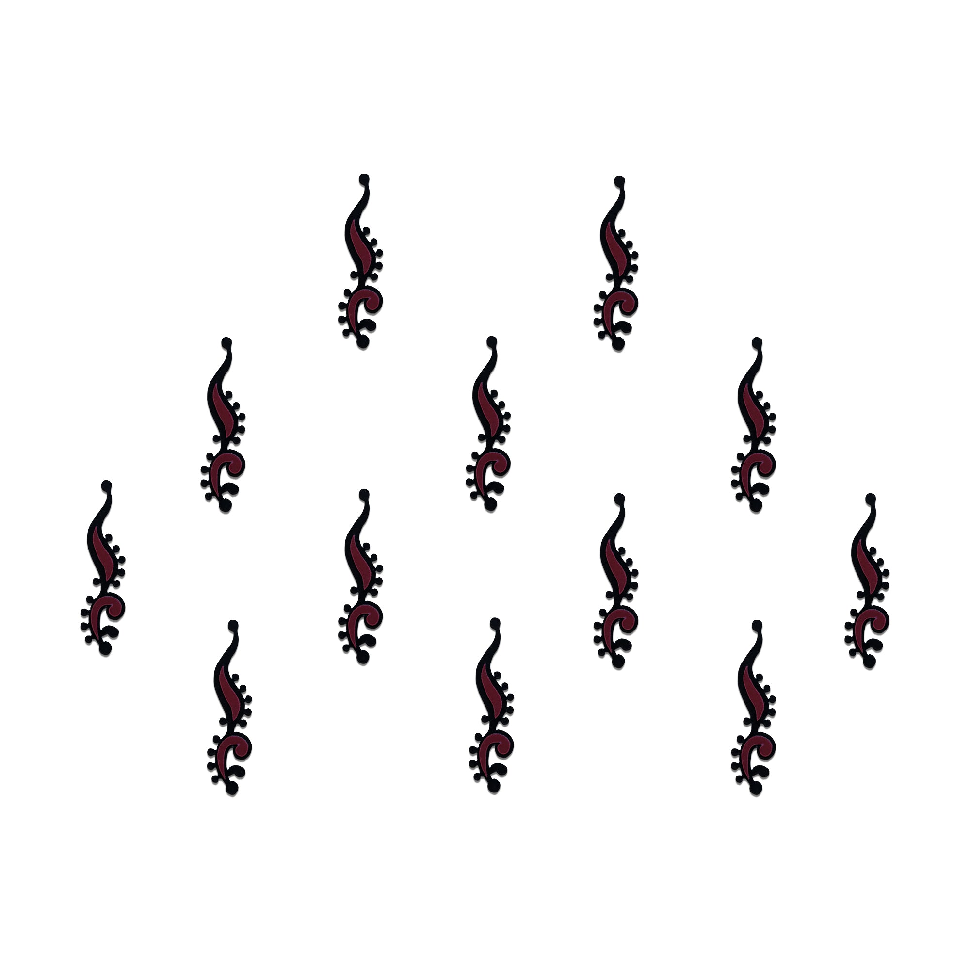 Comet Busters geometric tribal designer bindis featuring black abstract ethnic motifs with maroon diamond accents arranged in a symmetrical pattern on a light background for a bold contemporary traditional look.