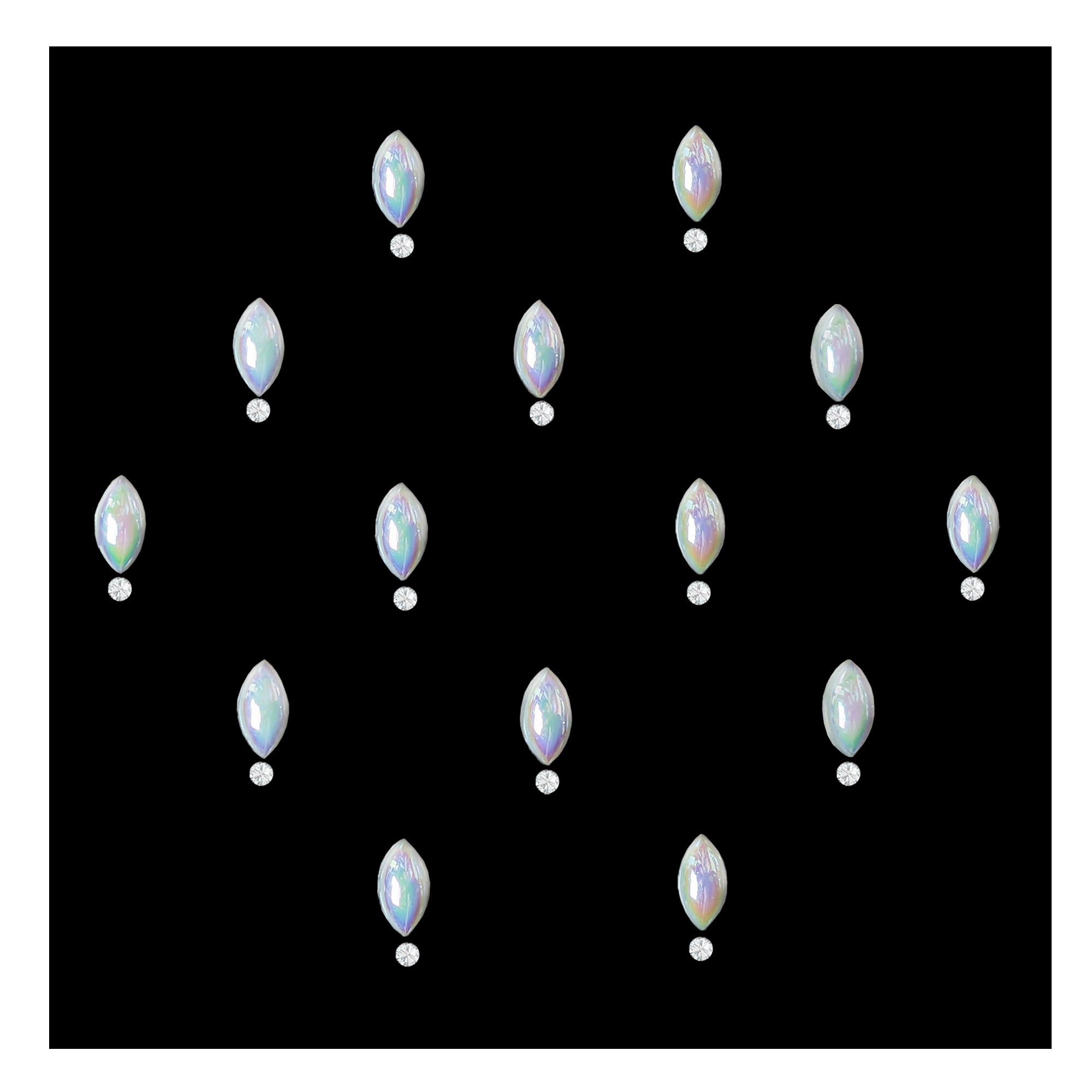 Comet Busters pearl drop stone bindis featuring glossy iridescent white teardrop-shaped stones paired with small crystal accents on a black background, elegant self-adhesive festive bindi set for women and girls.