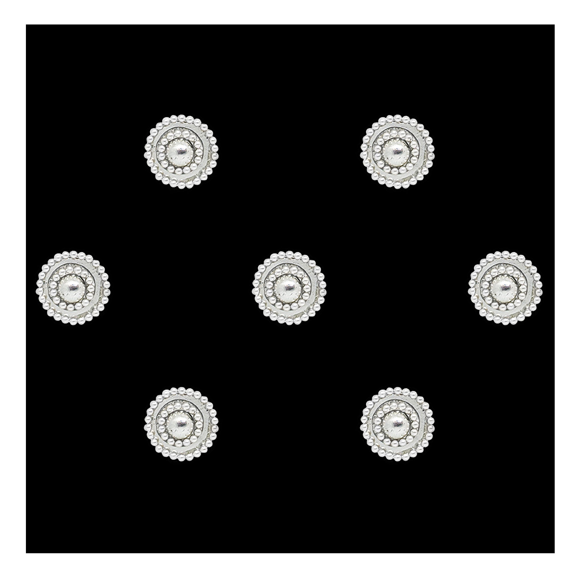 Comet Busters premium silver round bindis featuring a central metallic stone surrounded by sparkling crystal detailing and an elegant pearl halo border for festive and traditional wear styling.