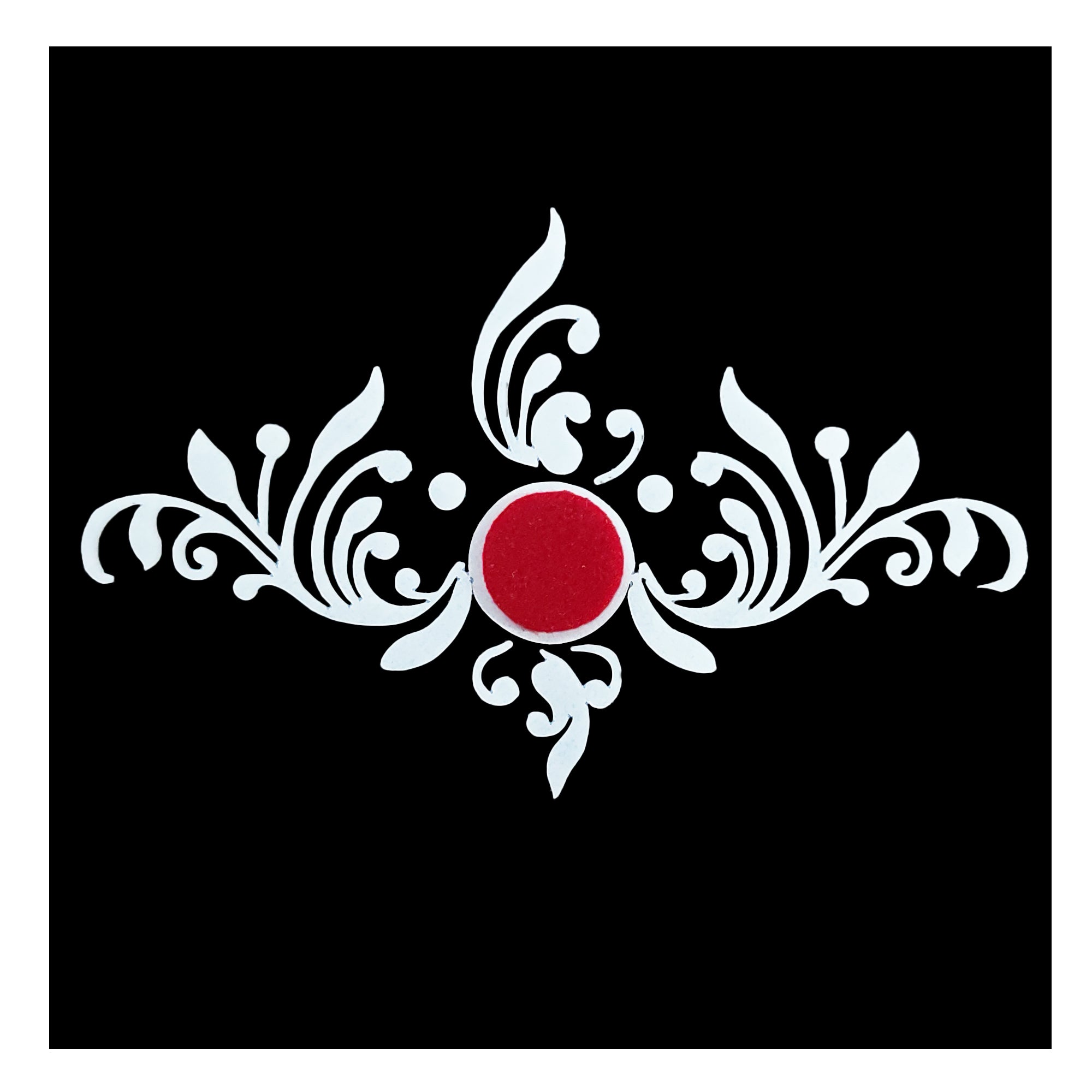 Comet Busters floral vine bindi featuring an elegant white leafy swirl design with a red center dot for bridal