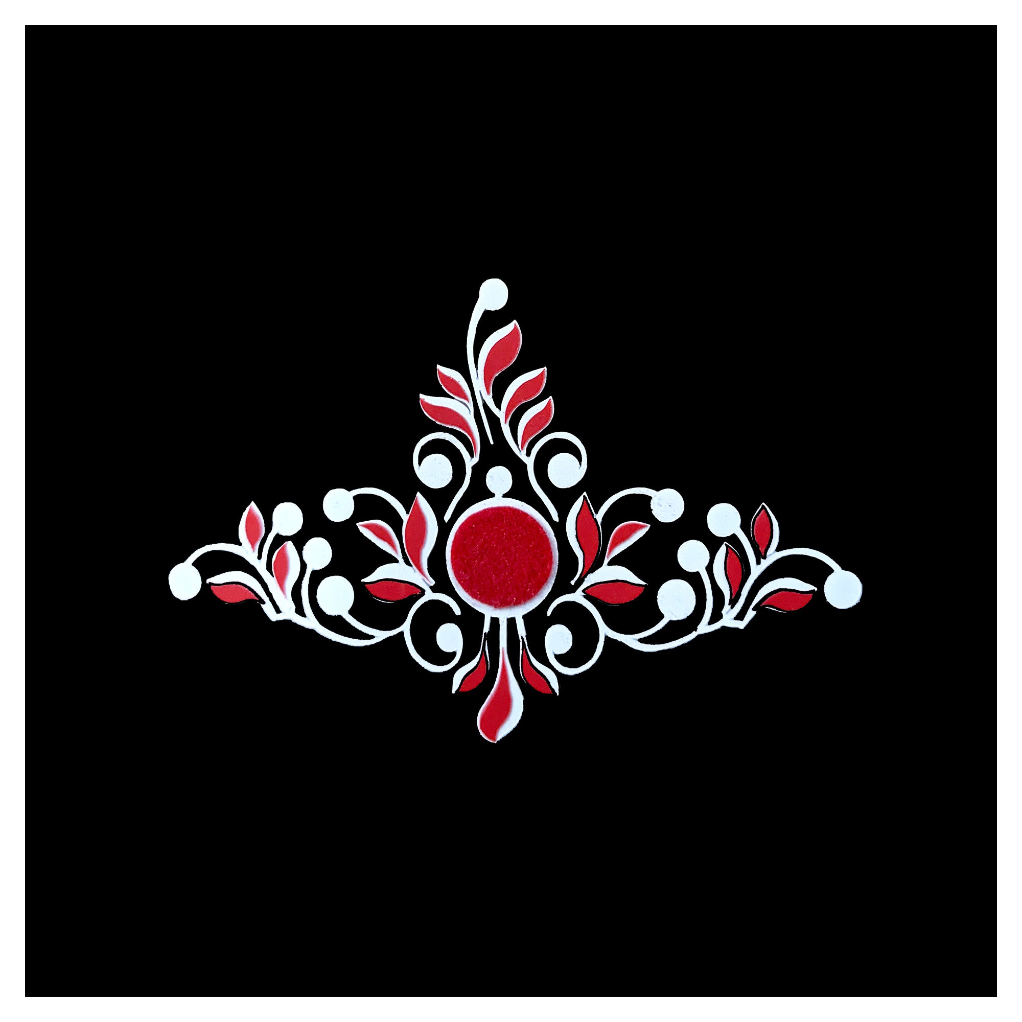 Comet Busters regal floral vine bindi featuring a red center with elegant white scrollwork and leaf motifs for festive and traditional wear.