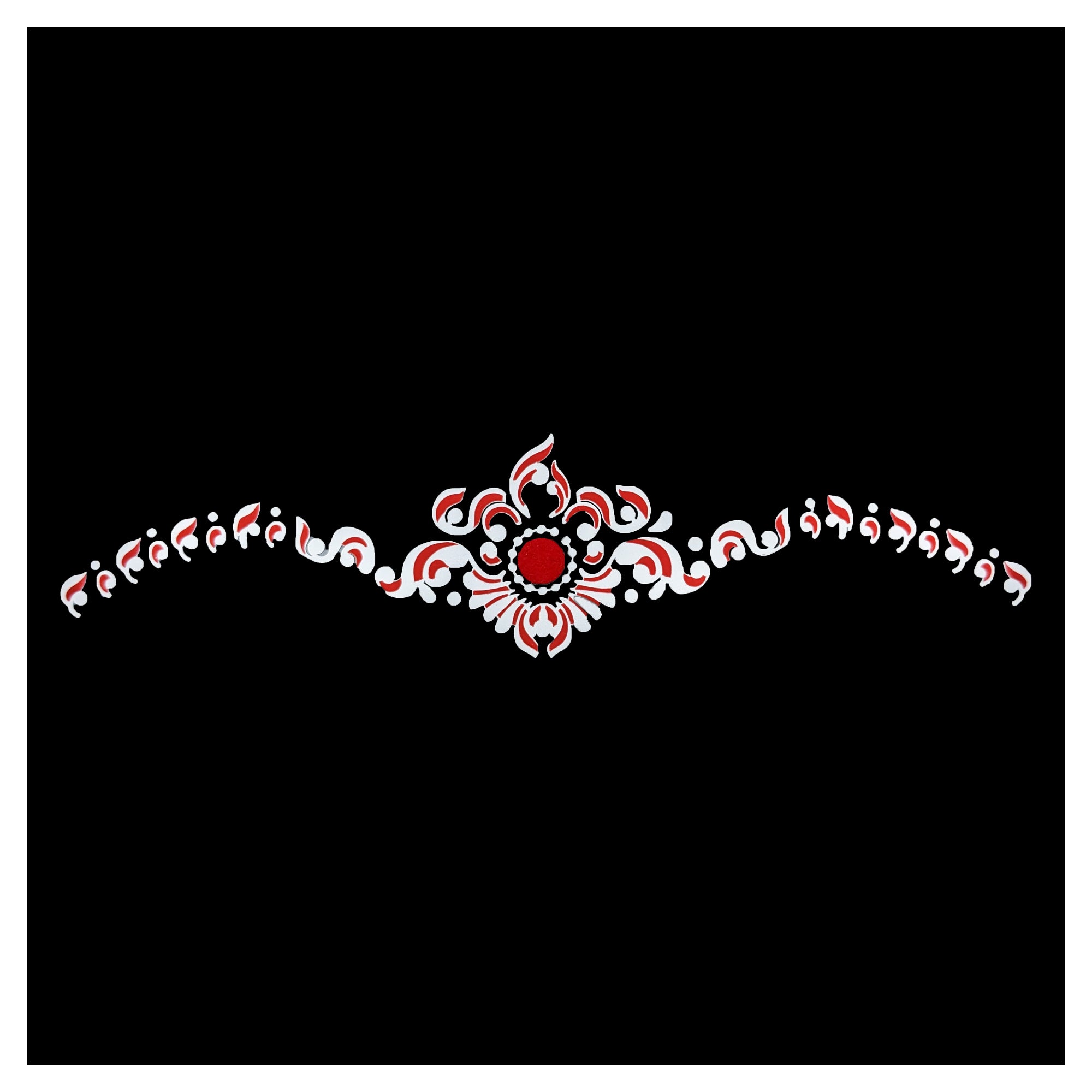 Comet Busters royal scrollwork designer bindi featuring a red center with elegant red and white ornamental patterns extending across the forehead