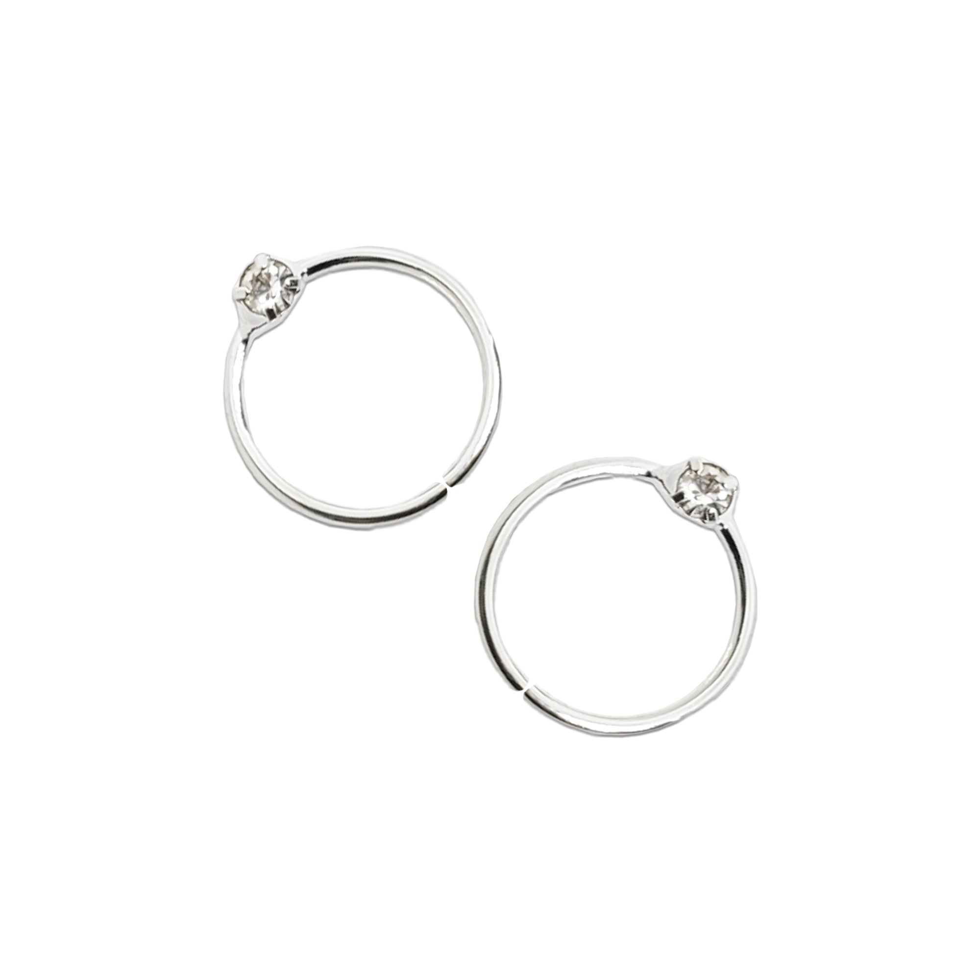 Comet Busters silver hoop nose studs featuring a single clear crystal stone in a round 