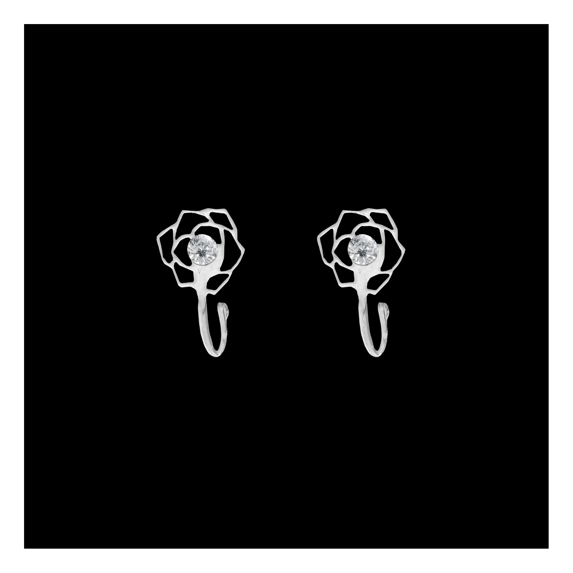 Comet Busters silver-tone flower-shaped nose stud featuring a delicate open-petal design and a sparkling clear crystal center with a long stick for easy application.