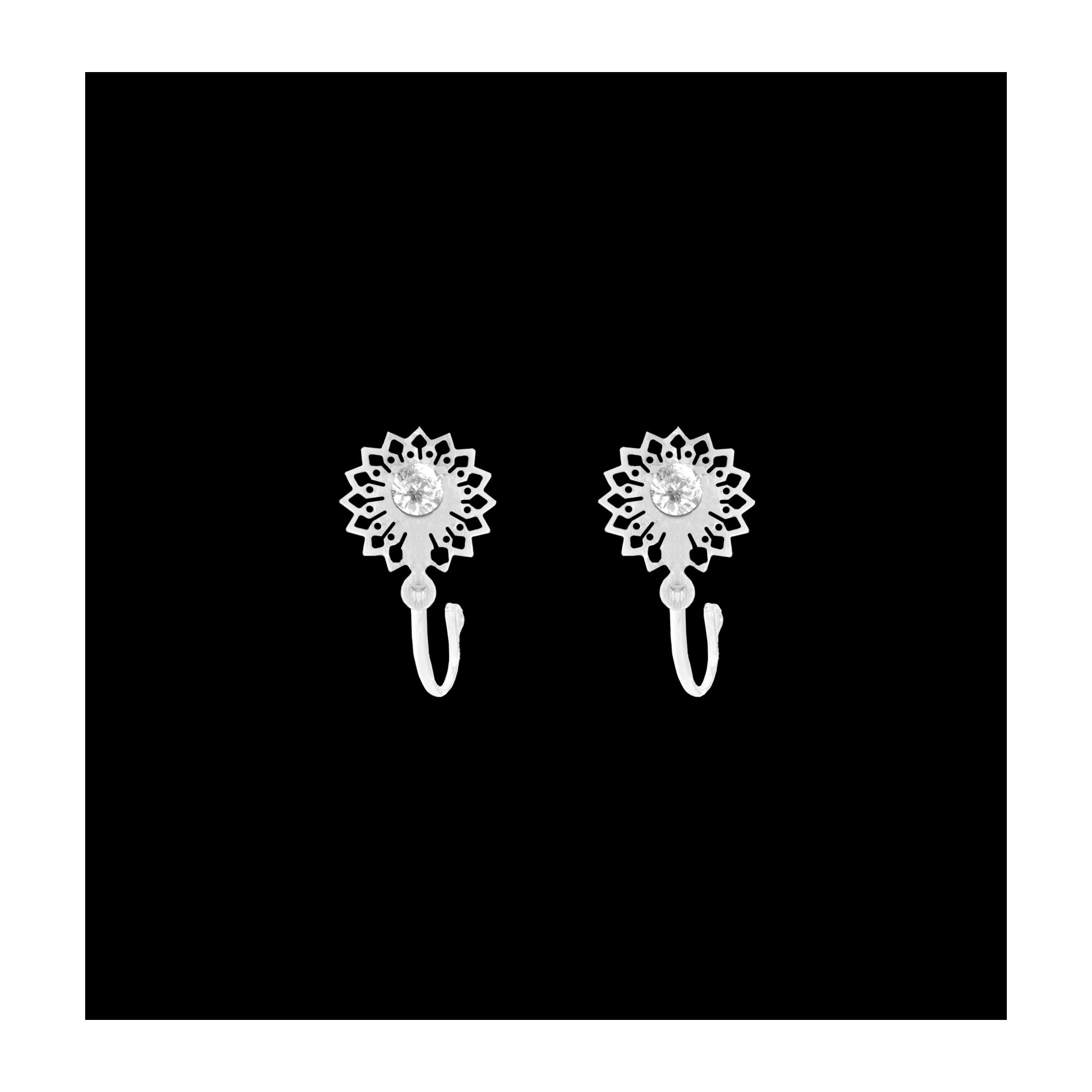 Comet Busters silver-tone mandala-inspired nose stud featuring an intricate floral pattern, sparkling clear center crystal, and a curved clip-on design for a traditional yet elegant look.
