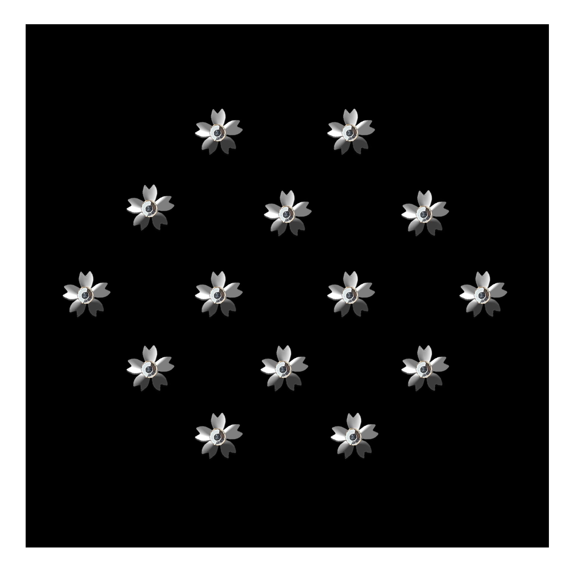 Silver floral designer bindi with petal-shaped detailing and sparkling crystal stone center, elegant stick-on forehead accessory for festive and ethnic wear.
