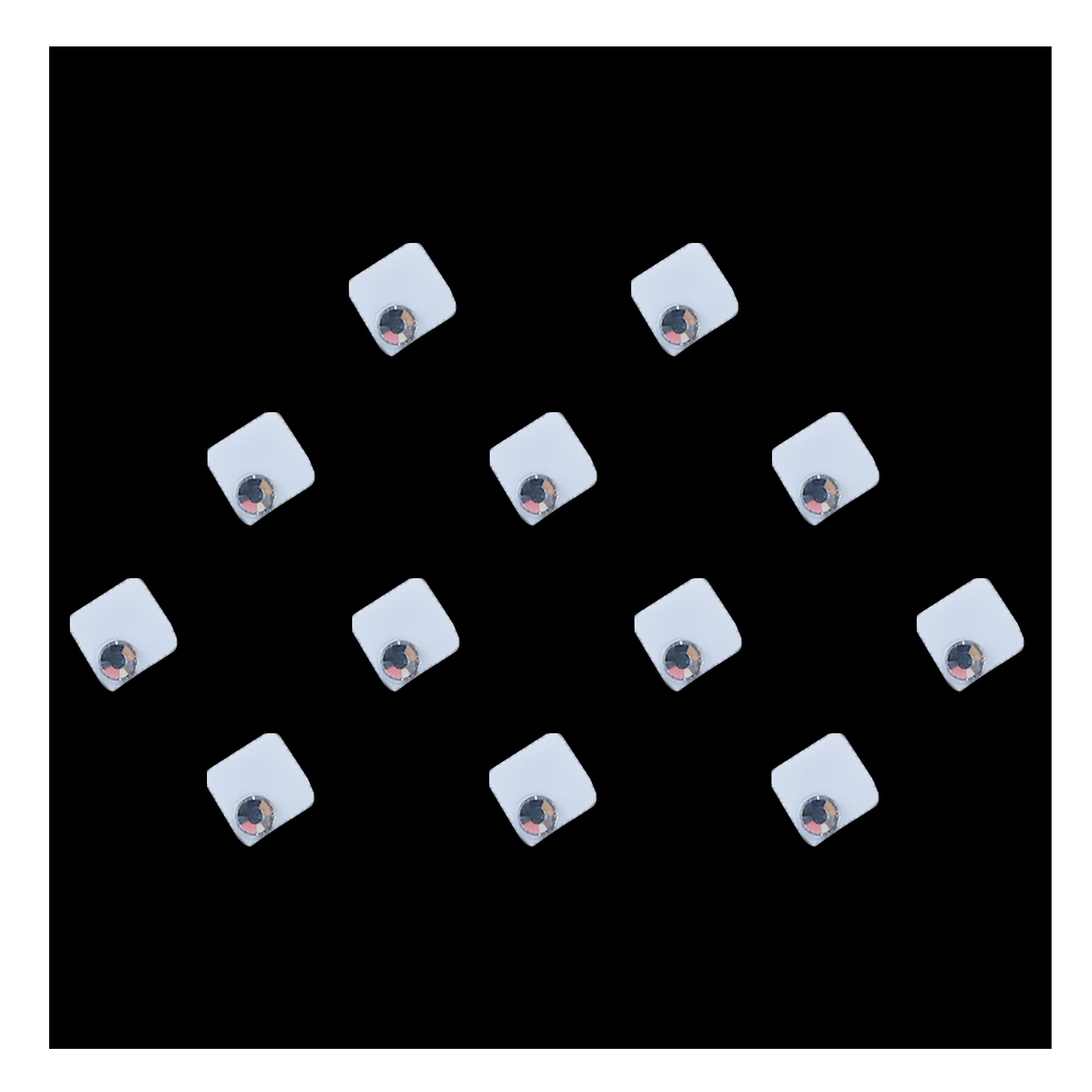 Comet Busters square crystal designer bindis featuring a modern geometric silver design with a sparkling crystal accent. Self-adhesive fashion bindis ideal for festive, ethnic, traditional, and contemporary styling.