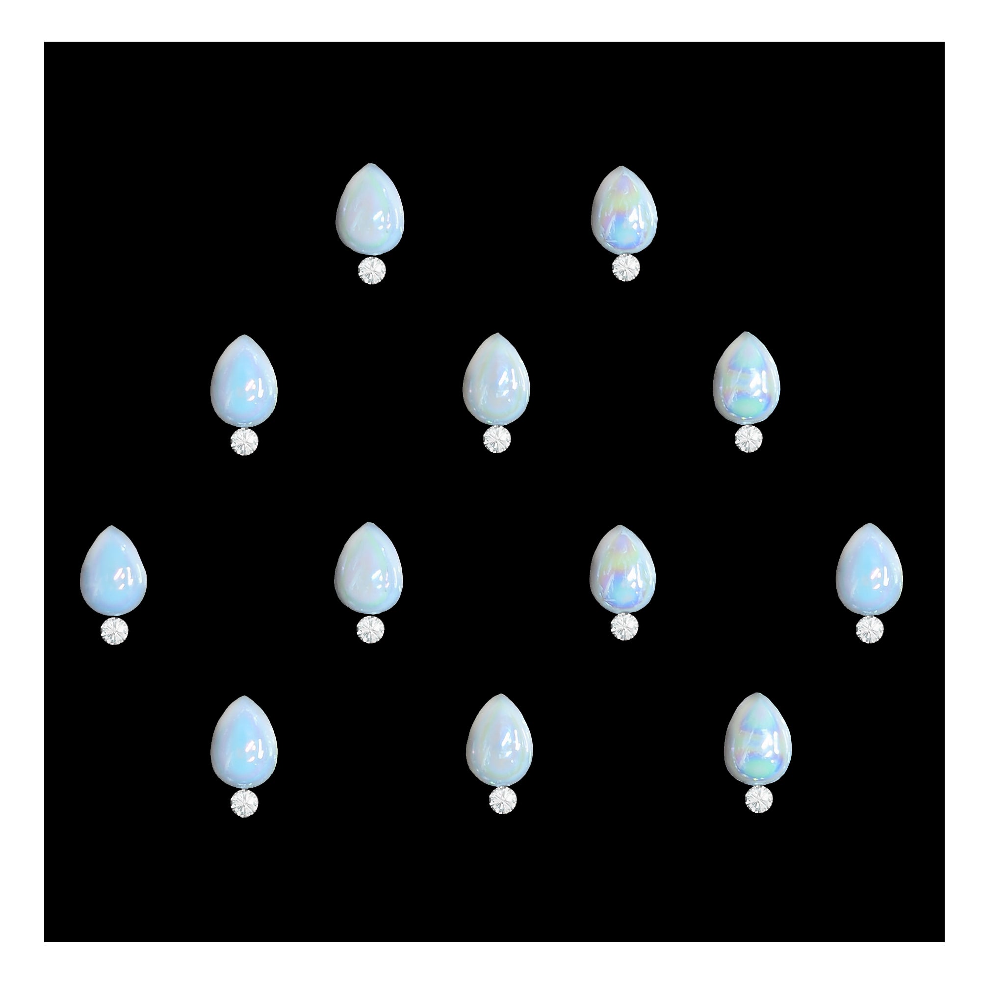Comet Busters pearl round stone bindis featuring glossy iridescent white circular stones paired with small crystal accents on a black background, elegant self-adhesive festive bindi set for women and girls.