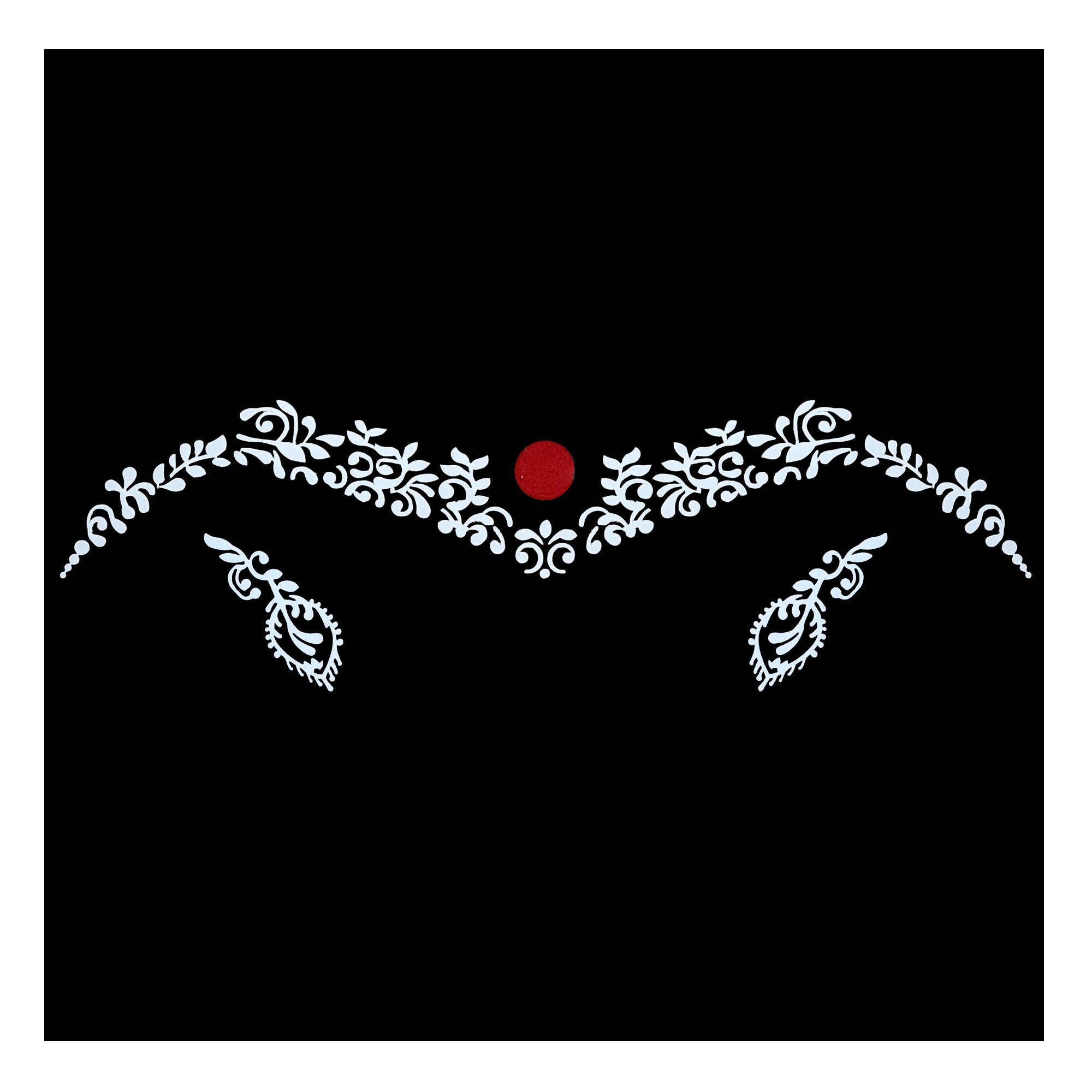 Comet Busters designer bindi featuring a white ornamental floral vine pattern with lotus-inspired detailing and a red velvet circular center on a black background, creating a bold traditional ethnic look.